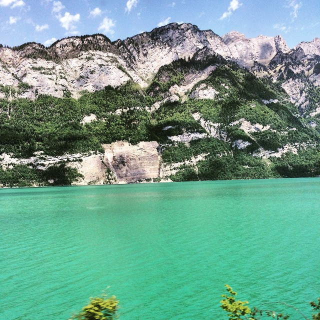 From yesterday's train ride — don't think I've ever seen a lake so turquoise and ostensibly utopian in my life.

This gem stretched for miles between a mountain range, sprinkled with quaint cottages and people out enjoying the weather. Took significant willpower not to pull the emergency stop for a dip! #swiss #Switzerland #nature #travel